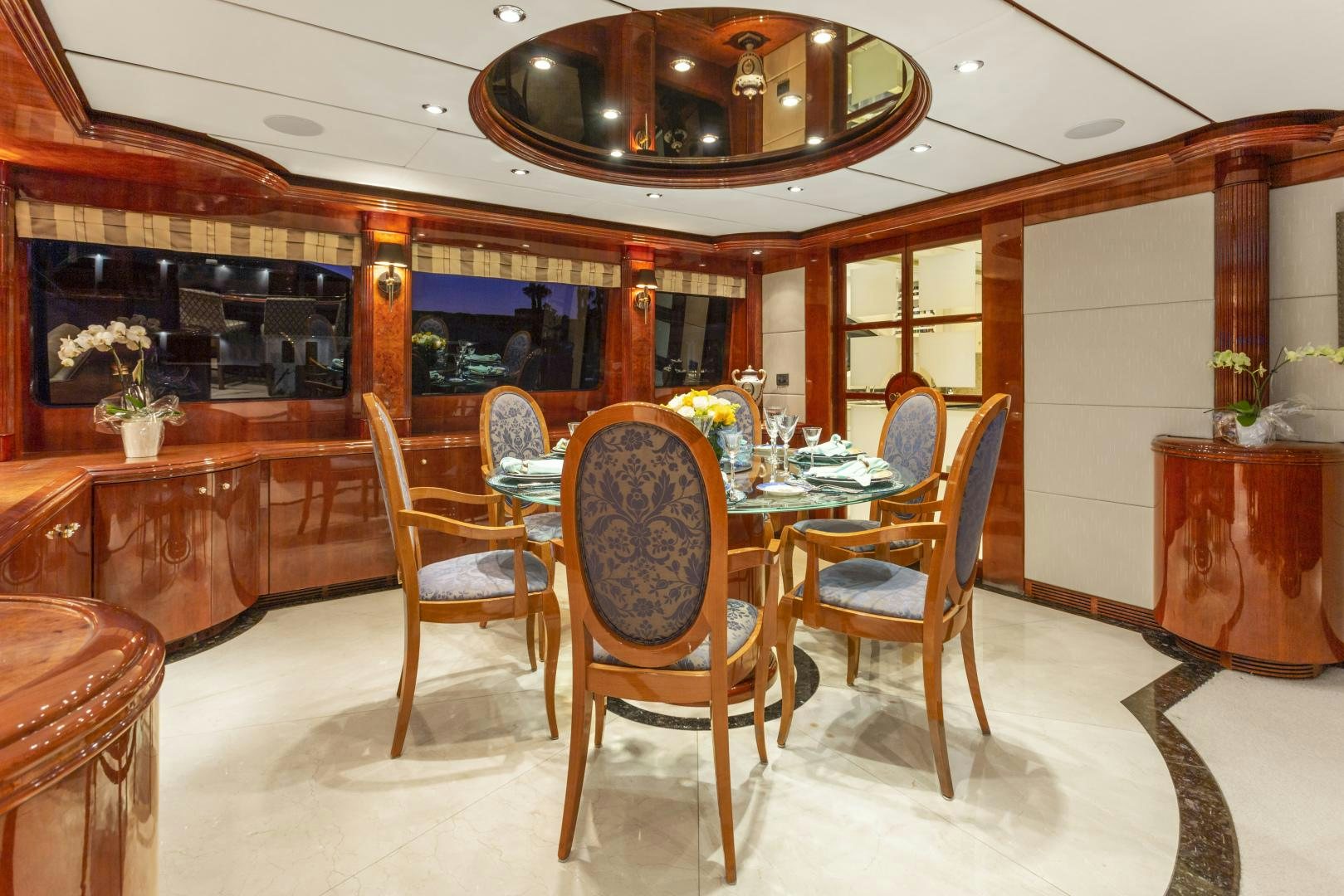 a dining room with a table and chairs aboard ANA’S INSPIRATION Yacht for Sale