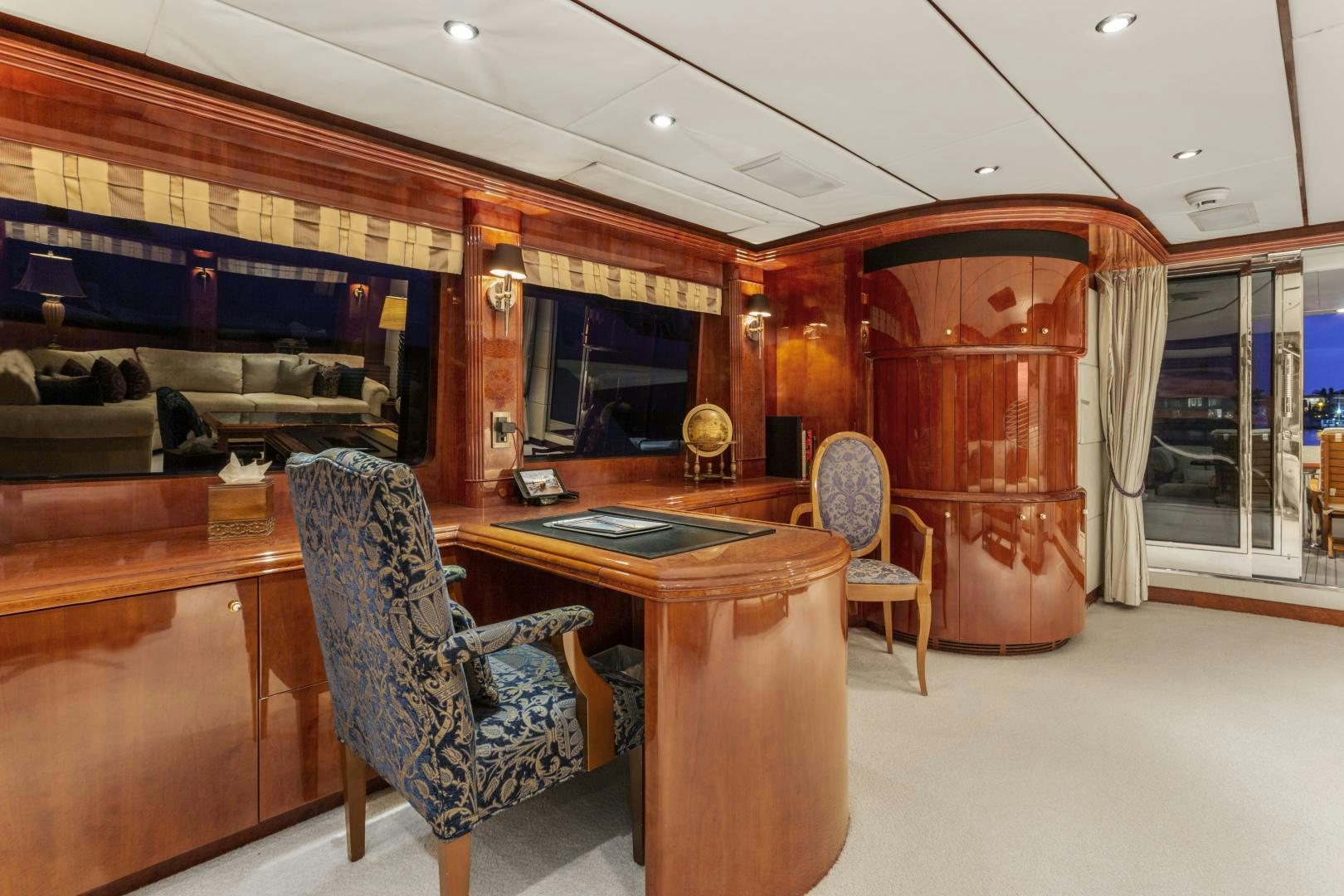 a room with a desk and chairs aboard ANA’S INSPIRATION Yacht for Sale