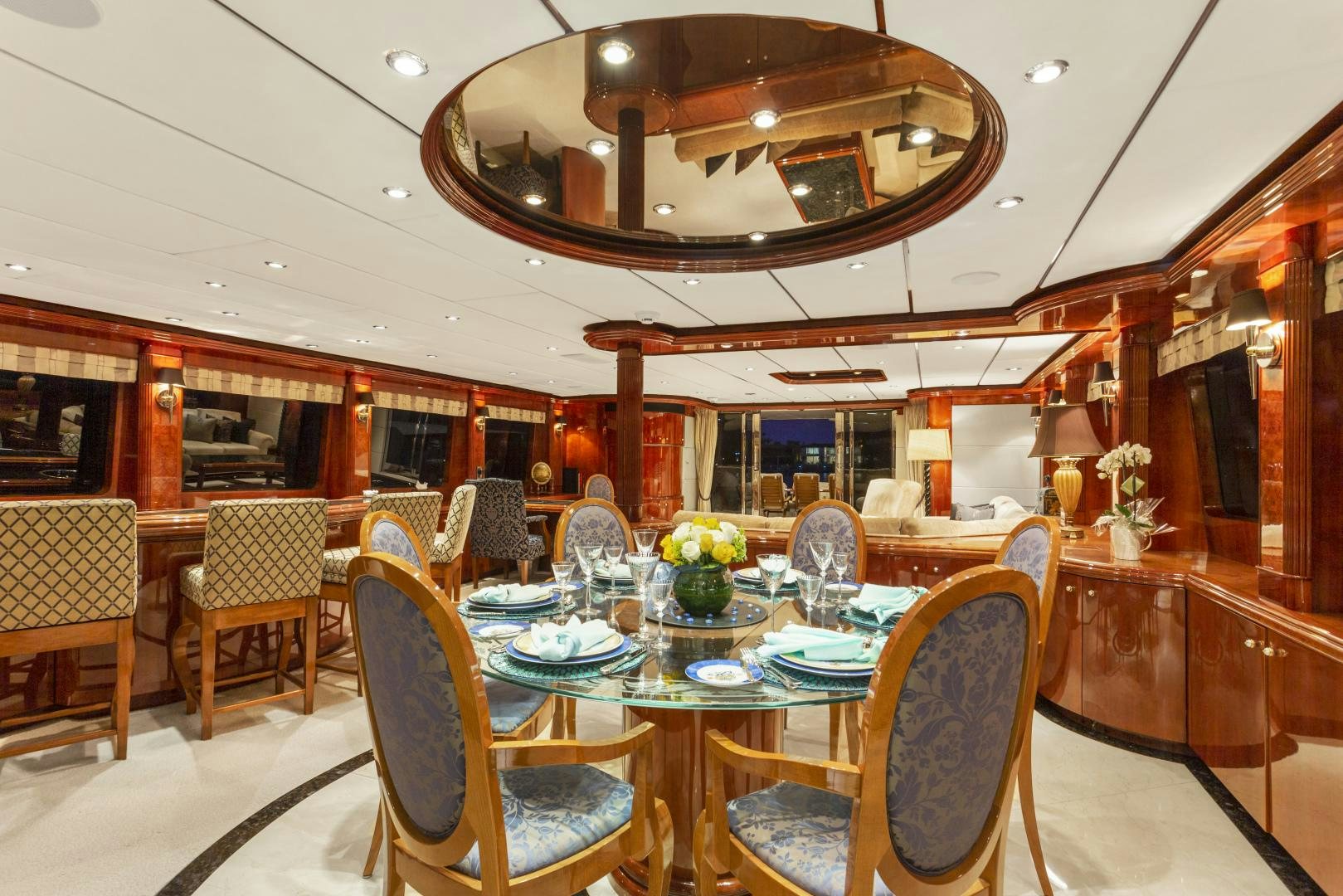 a dining room with a table and chairs aboard ANA’S INSPIRATION Yacht for Sale