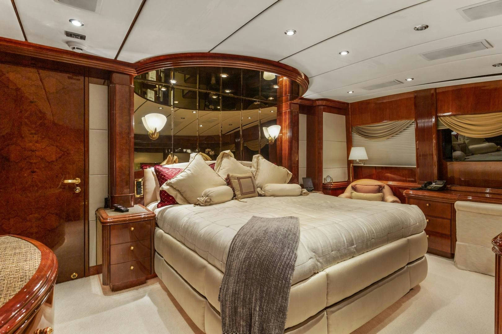 a large bedroom with a large mirror aboard ANA’S INSPIRATION Yacht for Sale