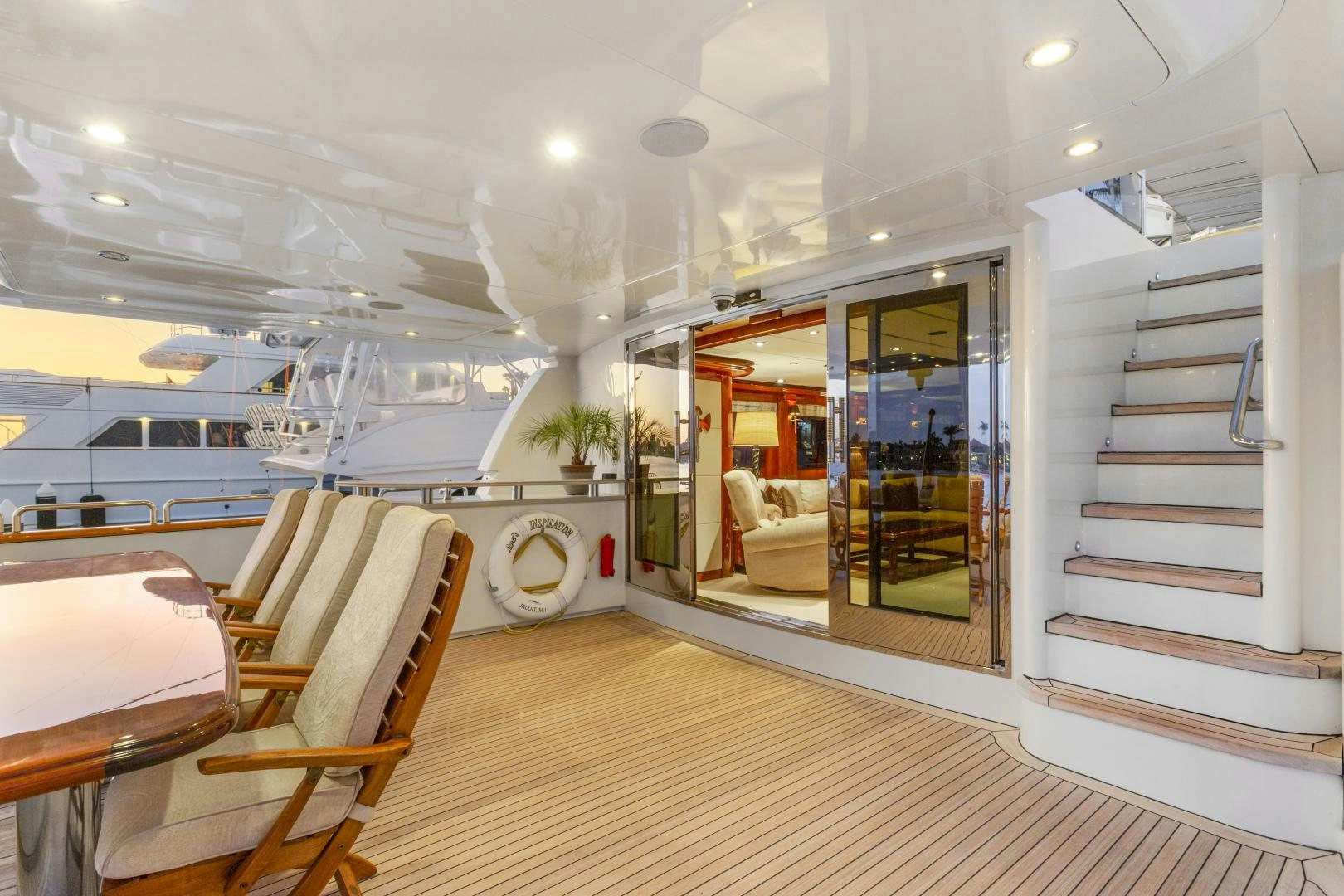 a room with a table and chairs aboard ANA’S INSPIRATION Yacht for Sale
