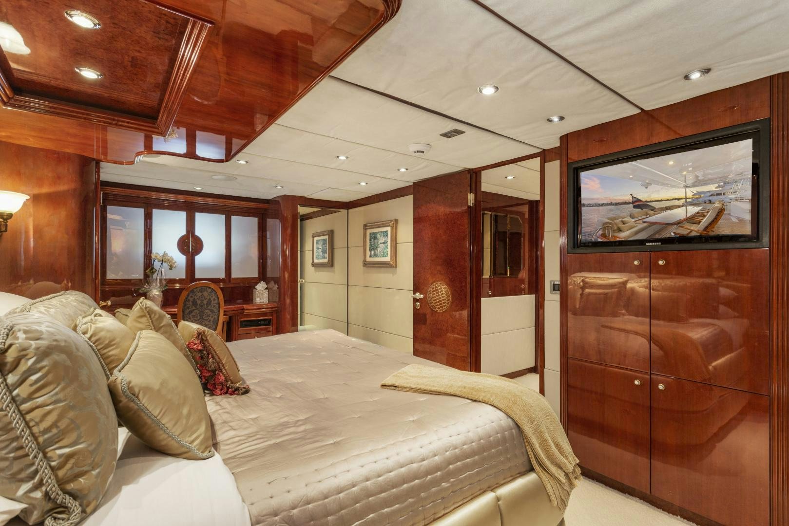 a bedroom with a bed and a television aboard ANA’S INSPIRATION Yacht for Sale
