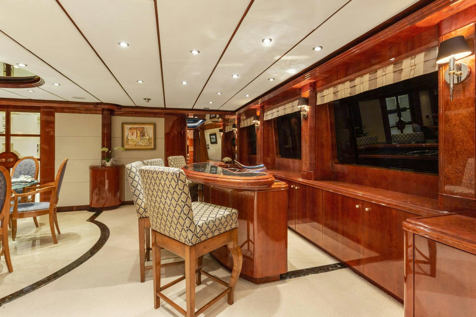 a room with a table chairs and a television aboard ANA’S INSPIRATION Yacht for Sale