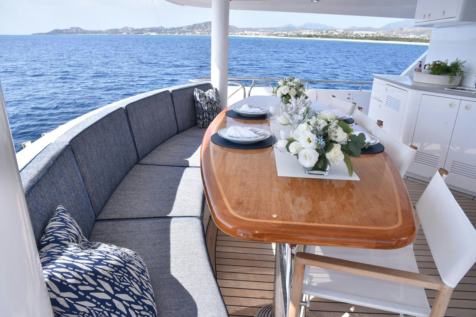 a table with flowers on it aboard BLUE STEELE Yacht for Sale