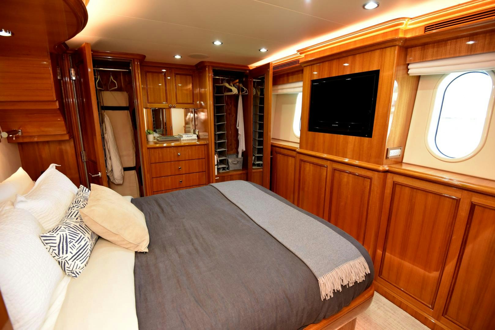 a bedroom with a bed and a tv aboard BLUE STEELE Yacht for Sale