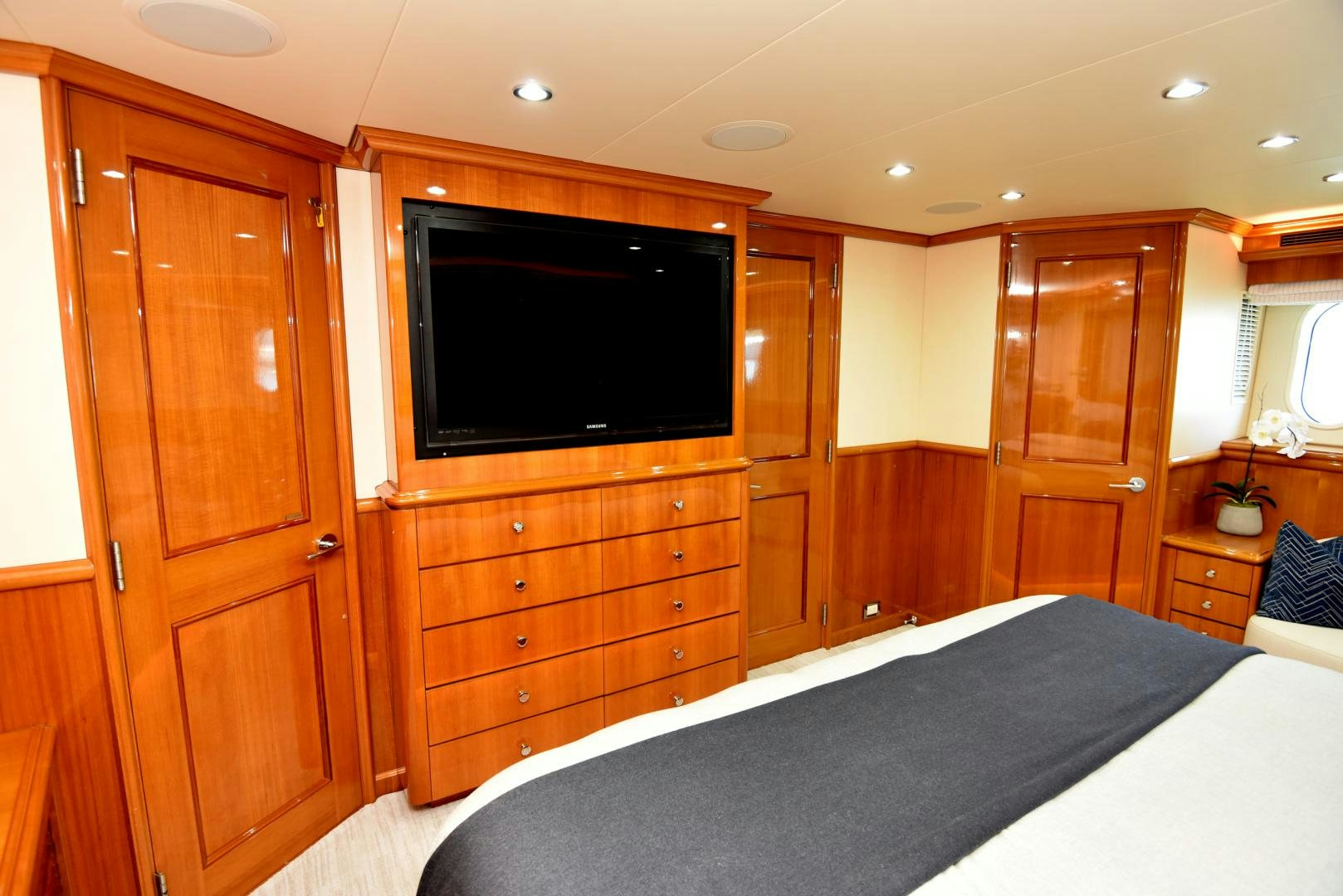 a bedroom with a bed and a tv aboard BLUE STEELE Yacht for Sale