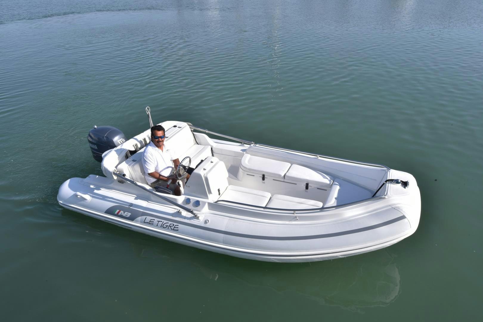 a man and a woman in a small white boat aboard BLUE STEELE Yacht for Sale