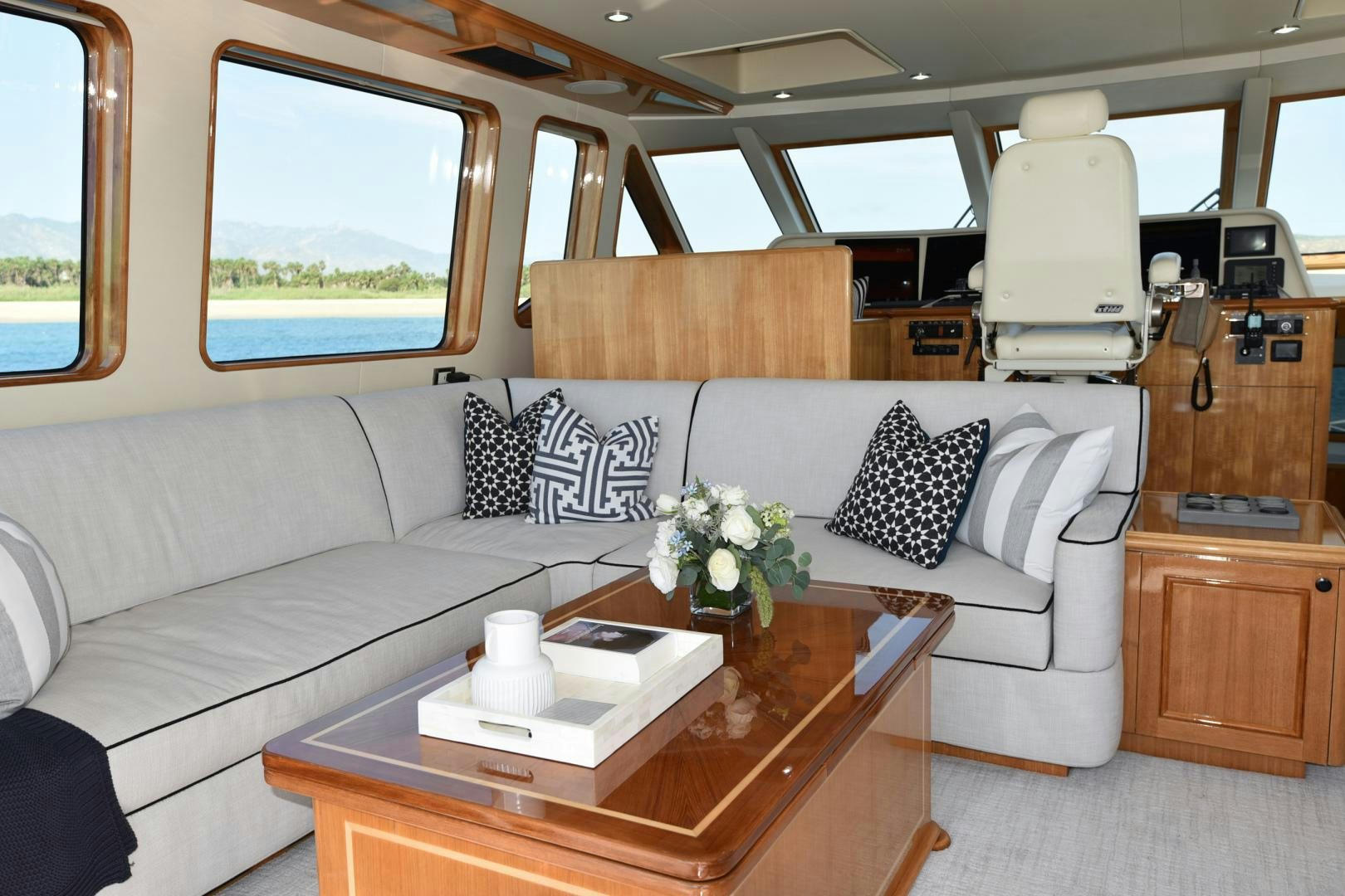 a white car with a table and chairs aboard BLUE STEELE Yacht for Sale
