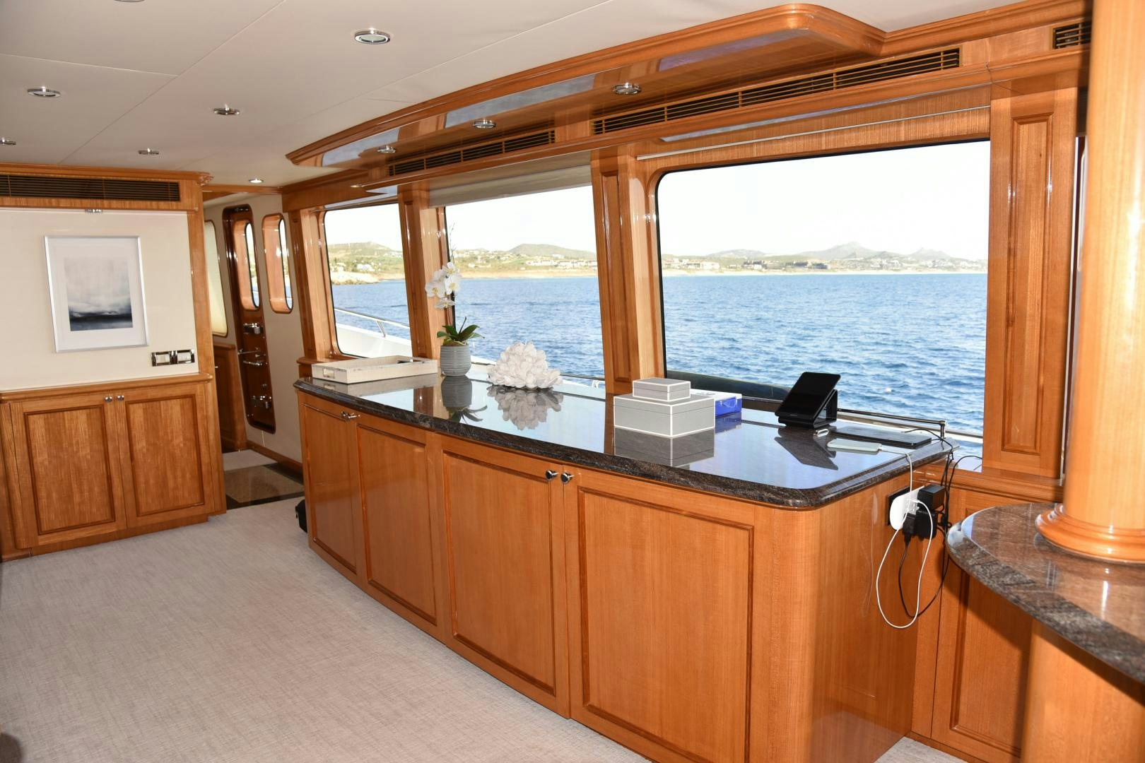 a kitchen with a large window aboard BLUE STEELE Yacht for Sale