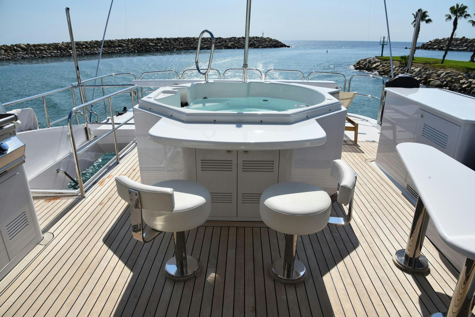 a table on a deck overlooking the ocean aboard BLUE STEELE Yacht for Sale
