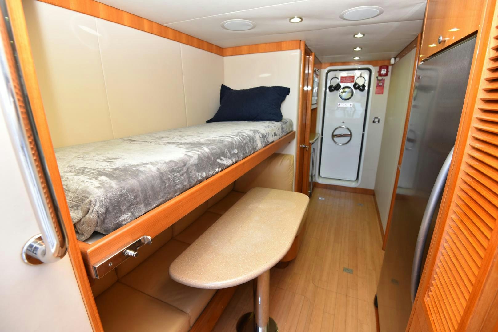 a bedroom with a bed and a desk aboard BLUE STEELE Yacht for Sale