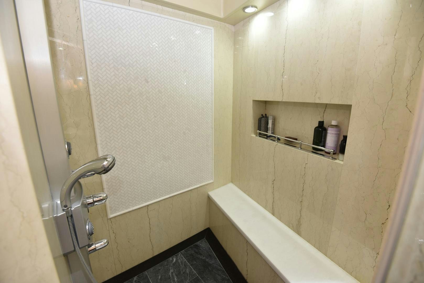 a bathroom with a tub and a sink aboard BLUE STEELE Yacht for Sale