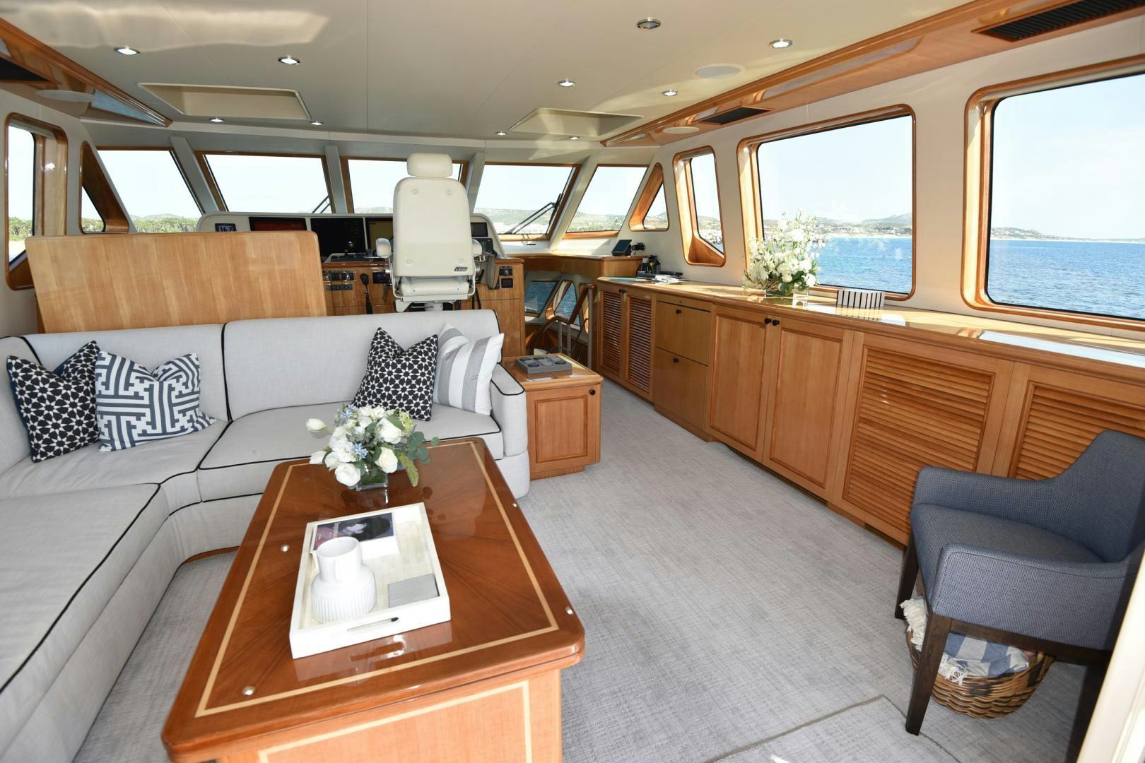 a living room with a couch and a table aboard BLUE STEELE Yacht for Sale