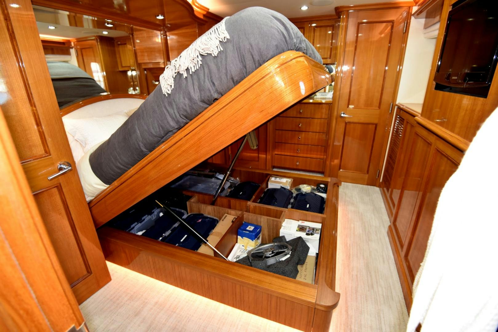 a room with a bed and a chair aboard BLUE STEELE Yacht for Sale
