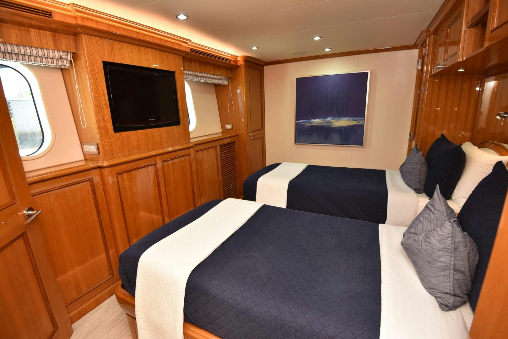 a bedroom with a bed and tv aboard BLUE STEELE Yacht for Sale