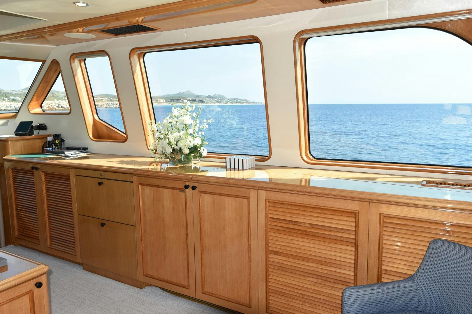 a room with a large window and a view of the ocean aboard BLUE STEELE Yacht for Sale