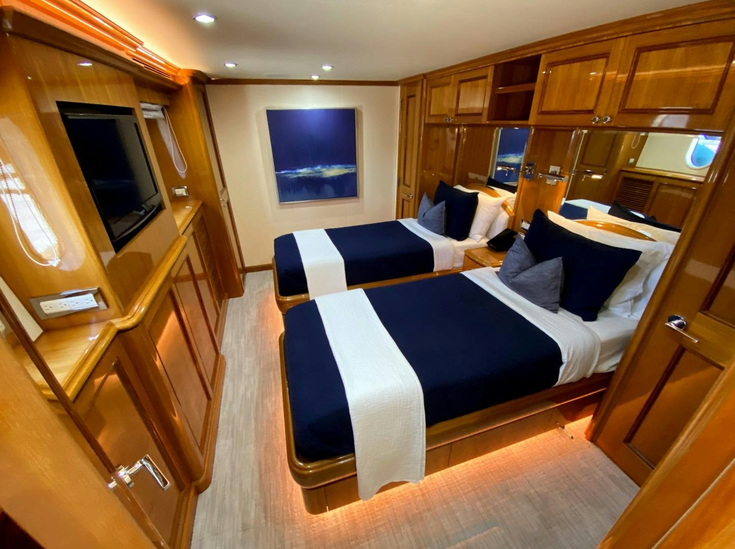 a room with a bed and a television aboard BLUE STEELE Yacht for Sale