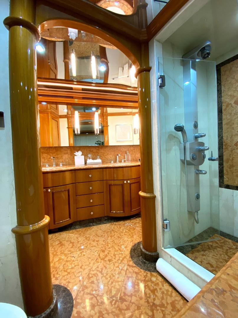 a bathroom with a large mirror aboard BLUE STEELE Yacht for Sale