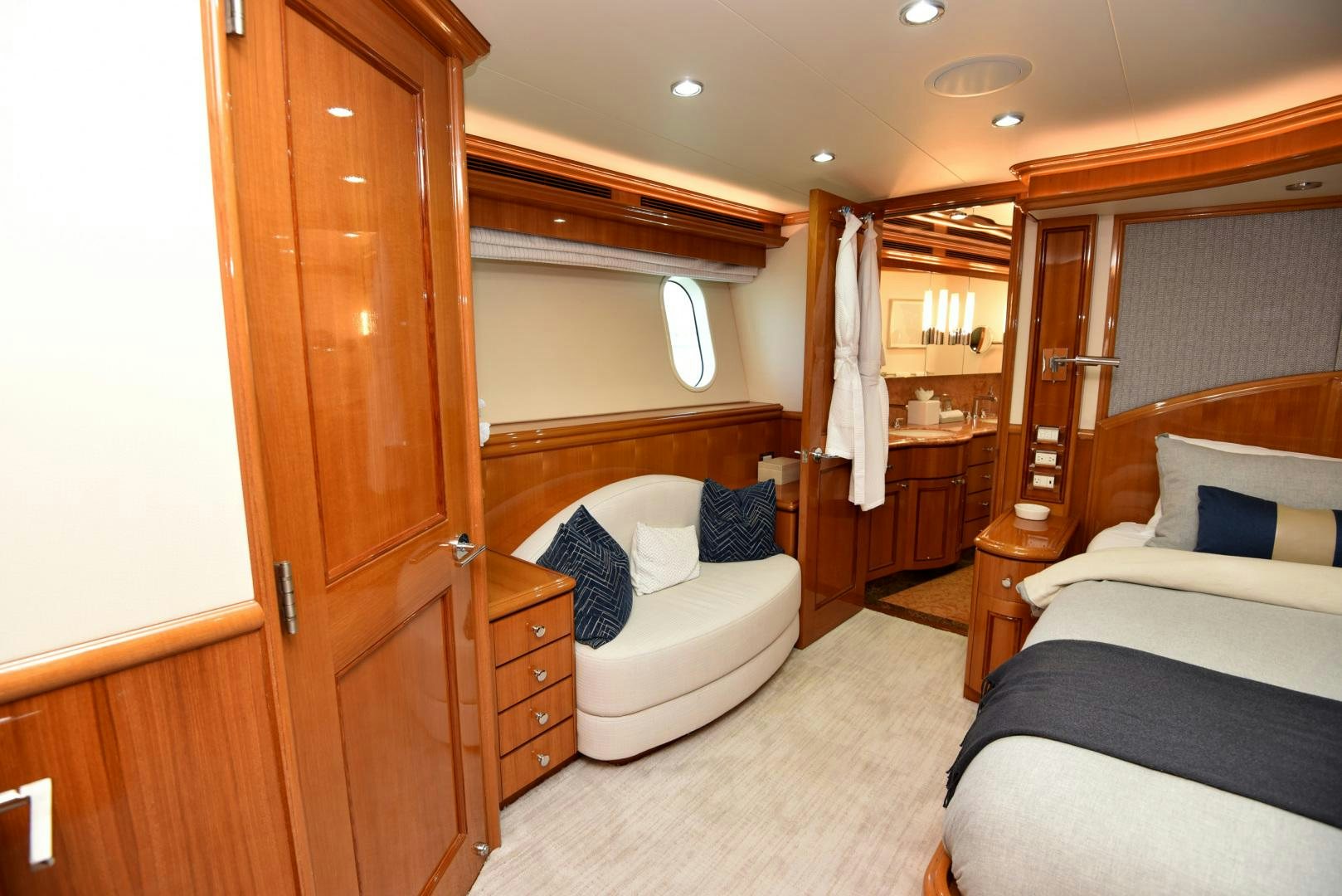 a bedroom with a bed and a closet aboard BLUE STEELE Yacht for Sale
