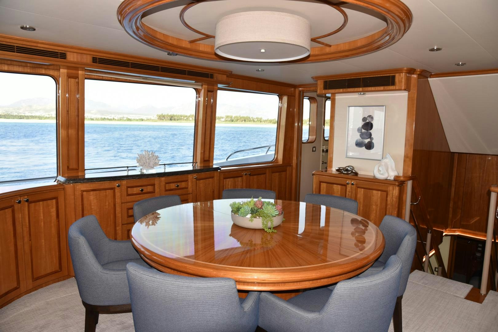 a dining table in a living room aboard BLUE STEELE Yacht for Sale