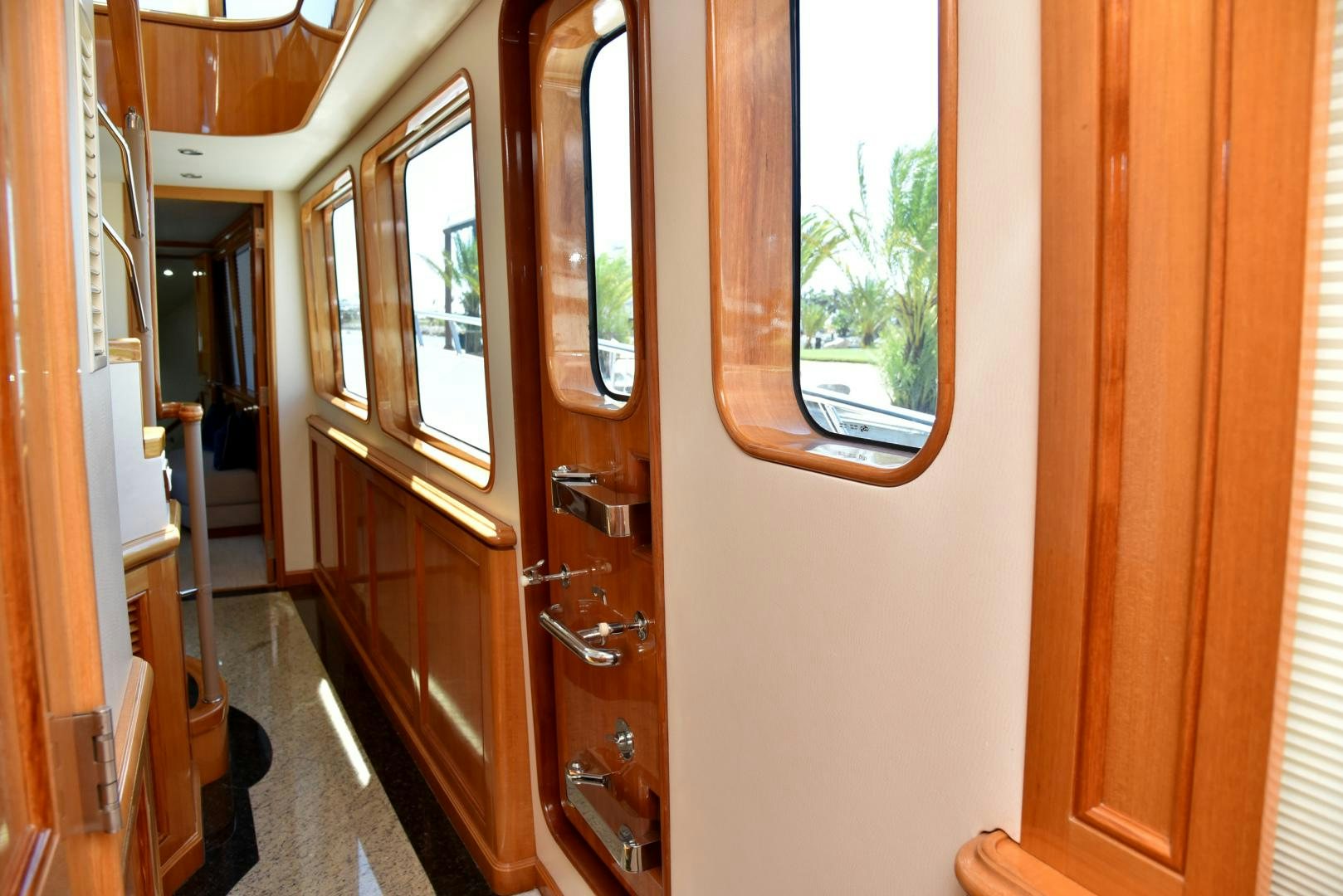 a hallway with a door and windows aboard BLUE STEELE Yacht for Sale