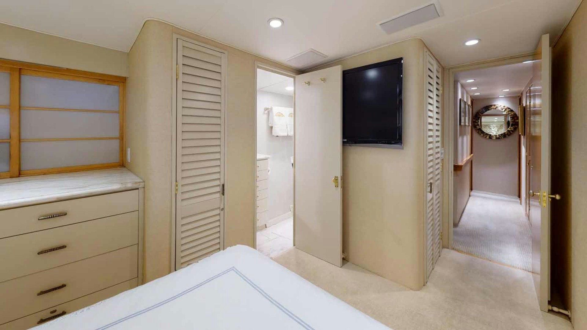 a room with a tv and a bed aboard LORELEI Yacht for Sale