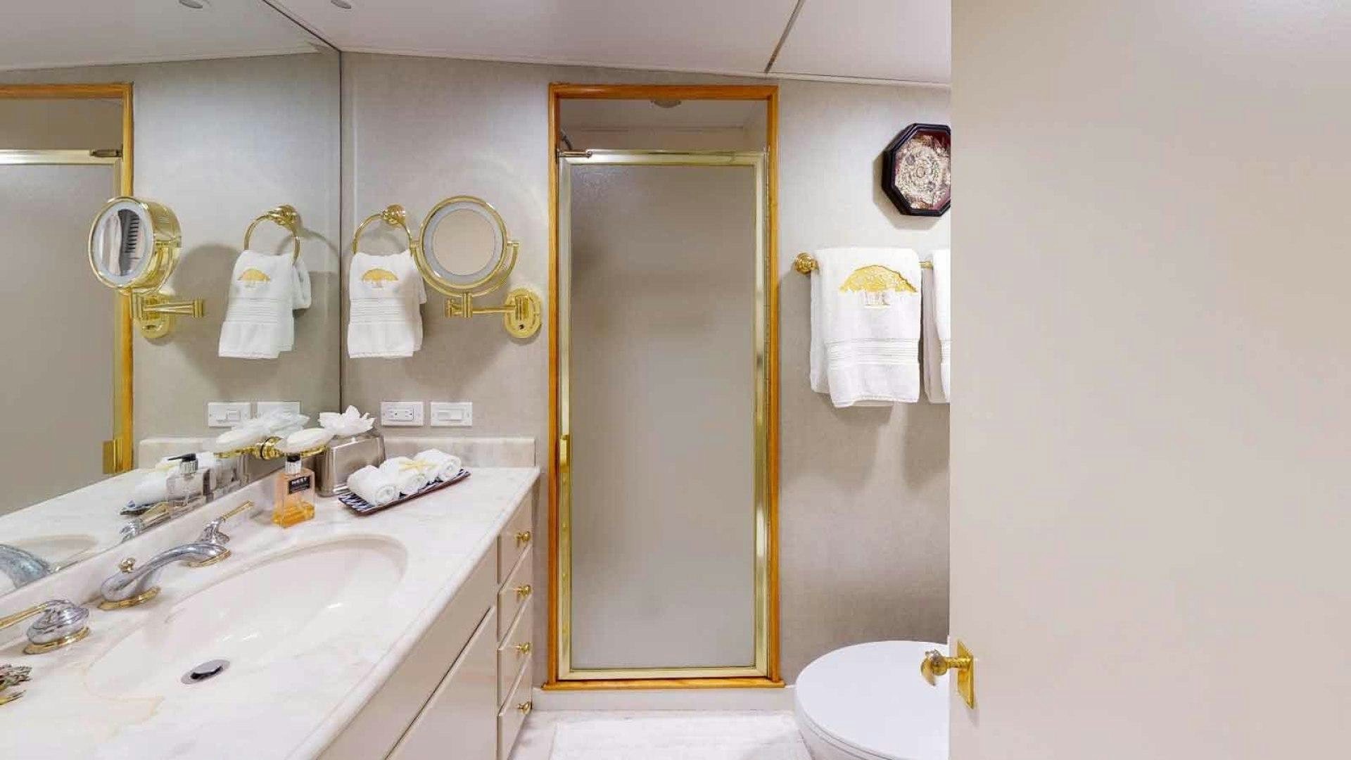 a bathroom with a sink and a mirror aboard LORELEI Yacht for Sale