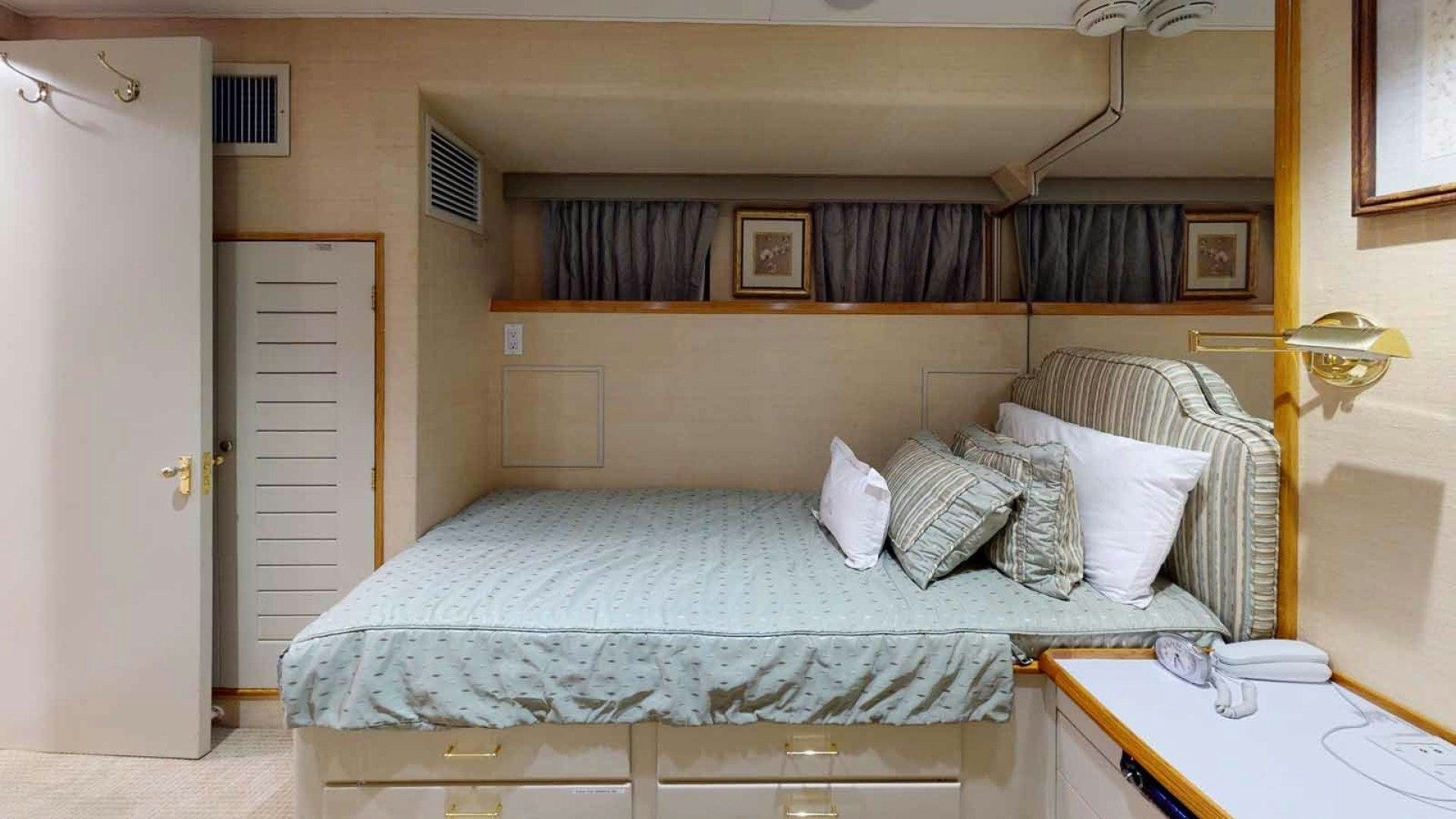 a bed with white sheets aboard LORELEI Yacht for Sale