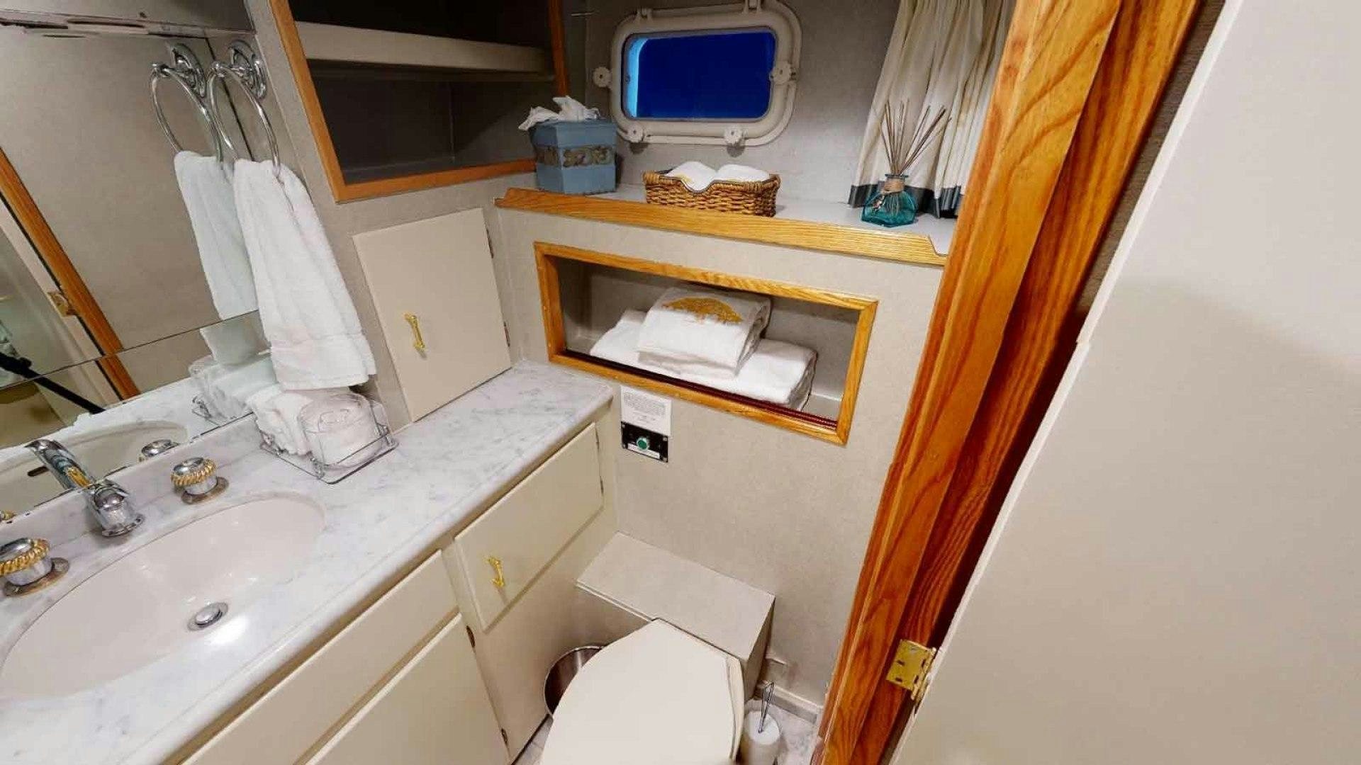 a bathroom with a sink and toilet aboard LORELEI Yacht for Sale