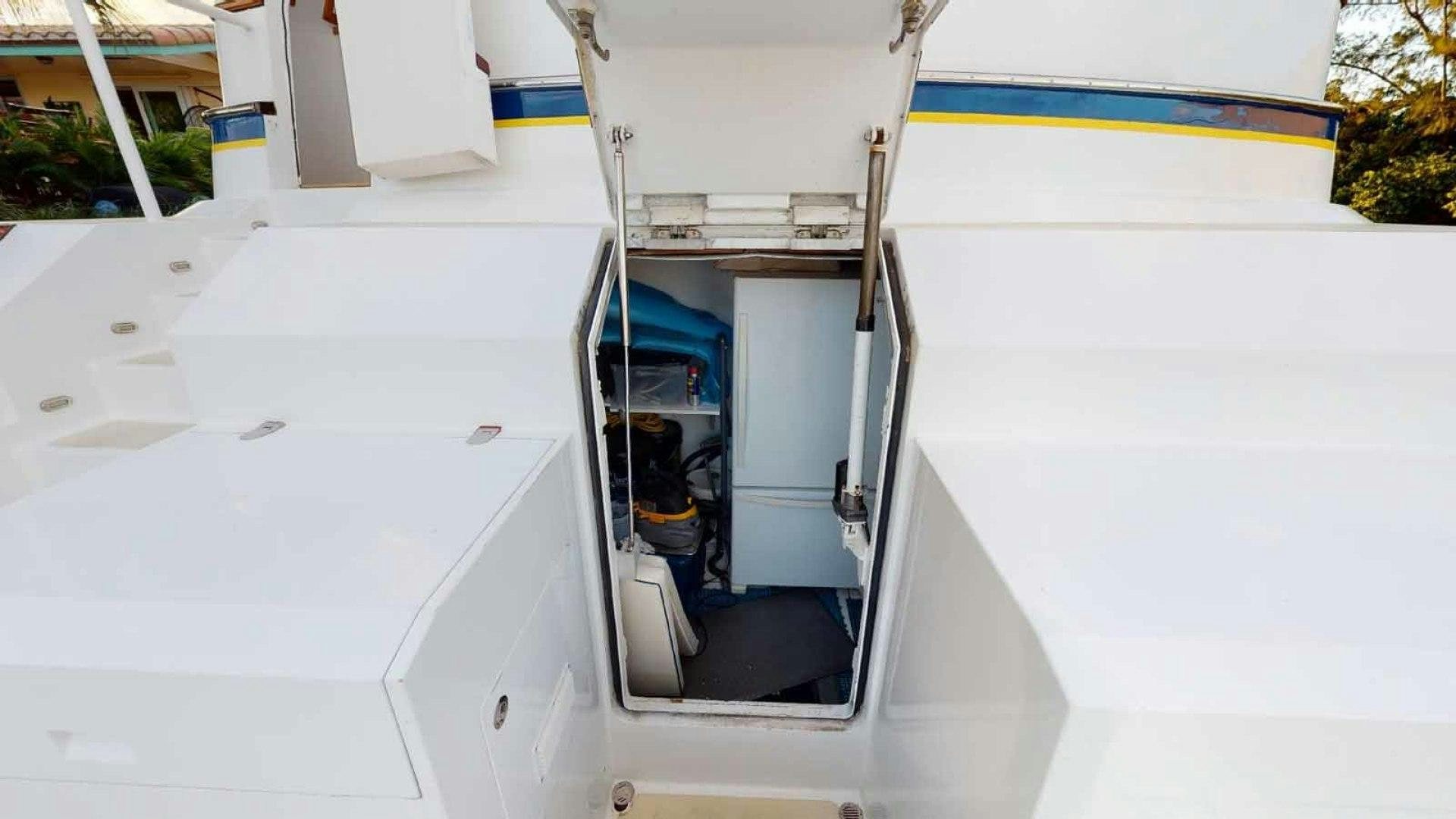 a white car with doors open aboard LORELEI Yacht for Sale