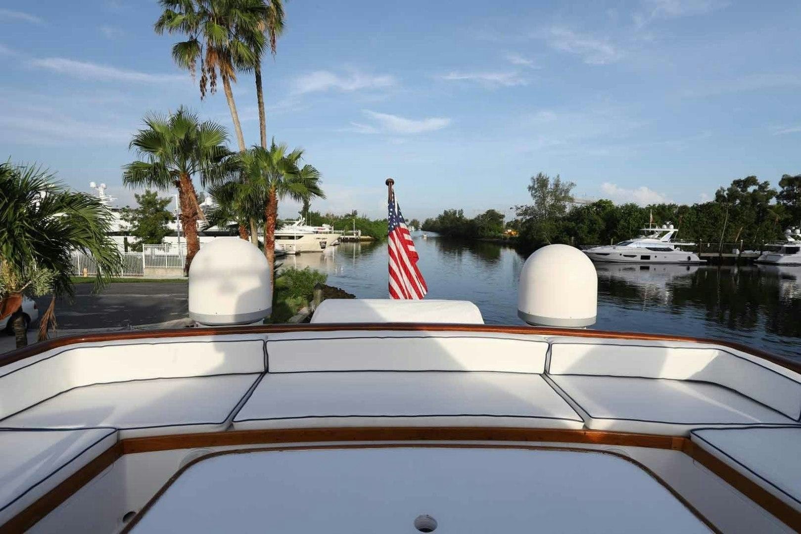 a boat with a flag on the front aboard LORELEI Yacht for Sale