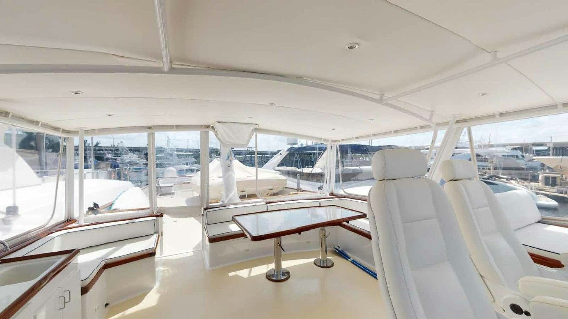 a room with a table and chairs aboard LORELEI Yacht for Sale