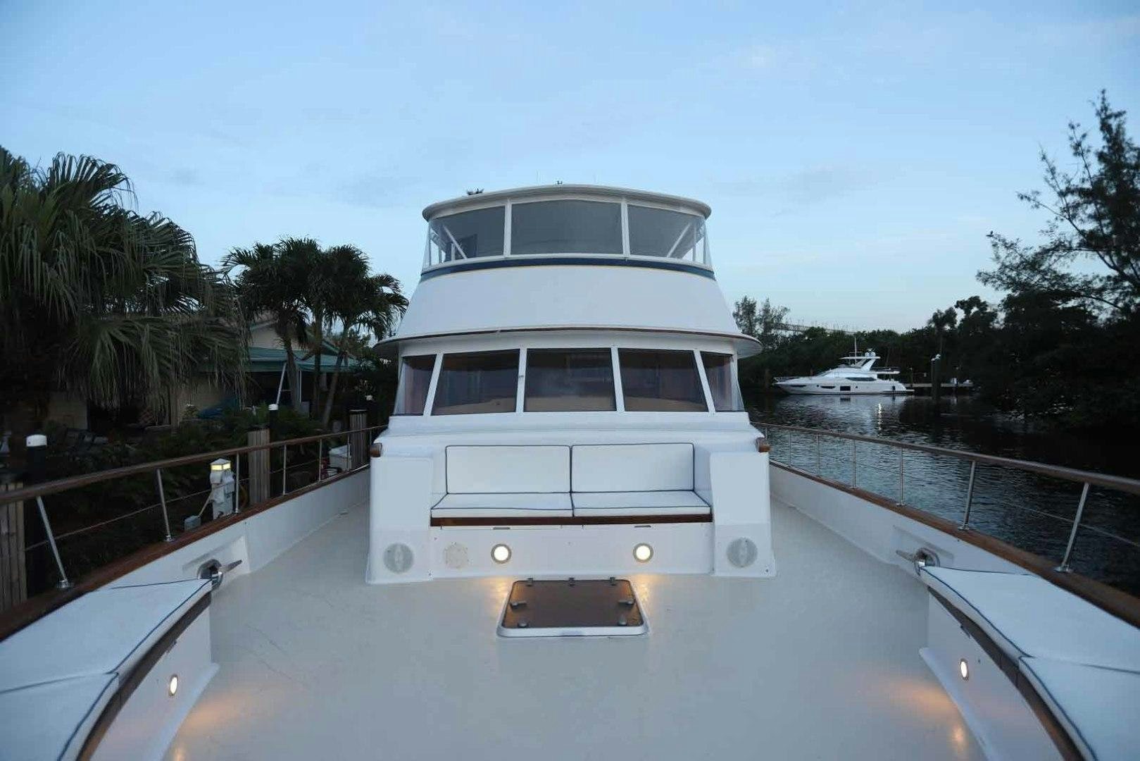 a white boat on a dock aboard LORELEI Yacht for Sale