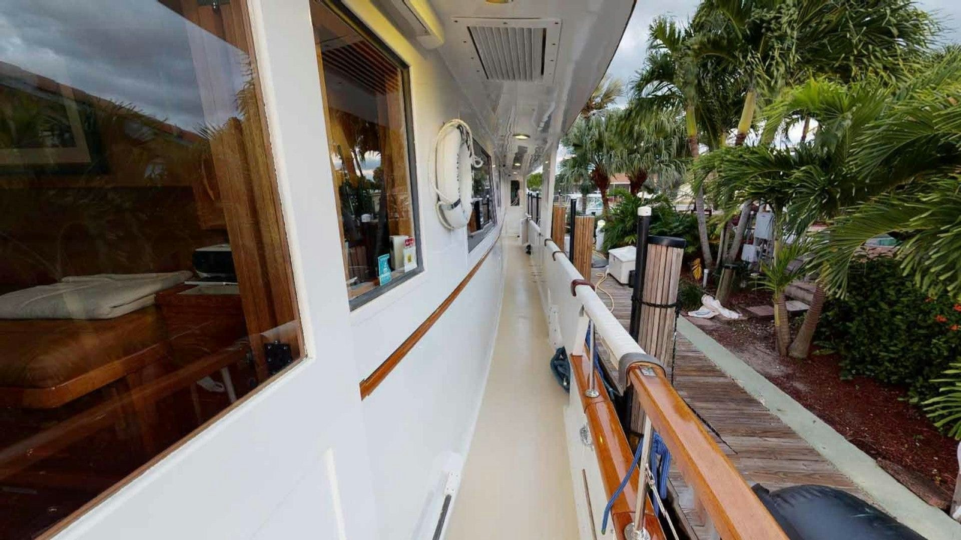 a balcony with a railing and palm trees aboard LORELEI Yacht for Sale