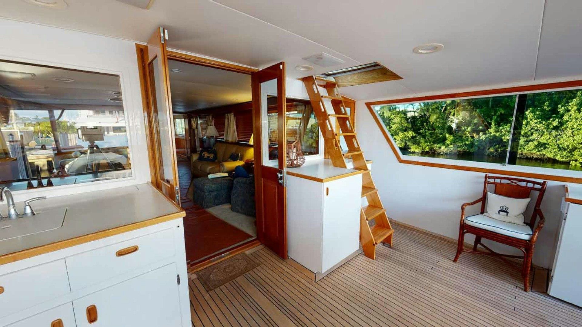 a room with a bunk bed and a chair aboard LORELEI Yacht for Sale