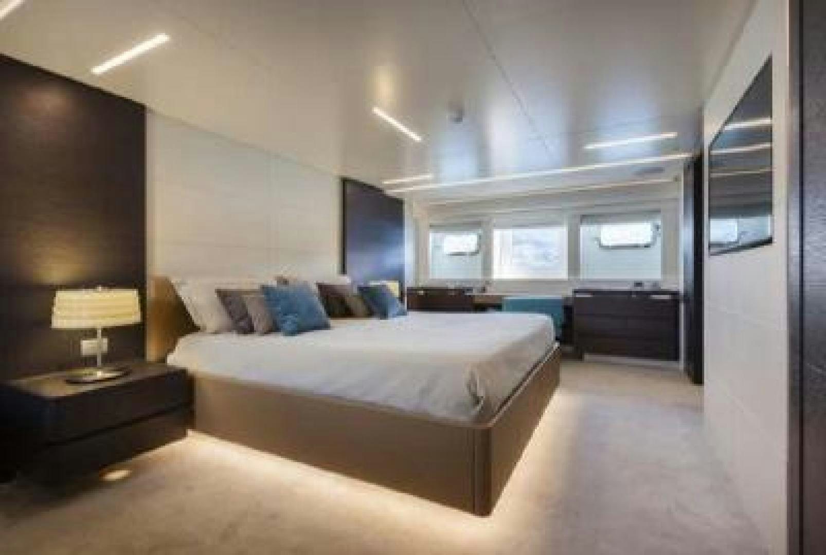 a large bedroom with a large bed aboard No Name Yacht for Sale