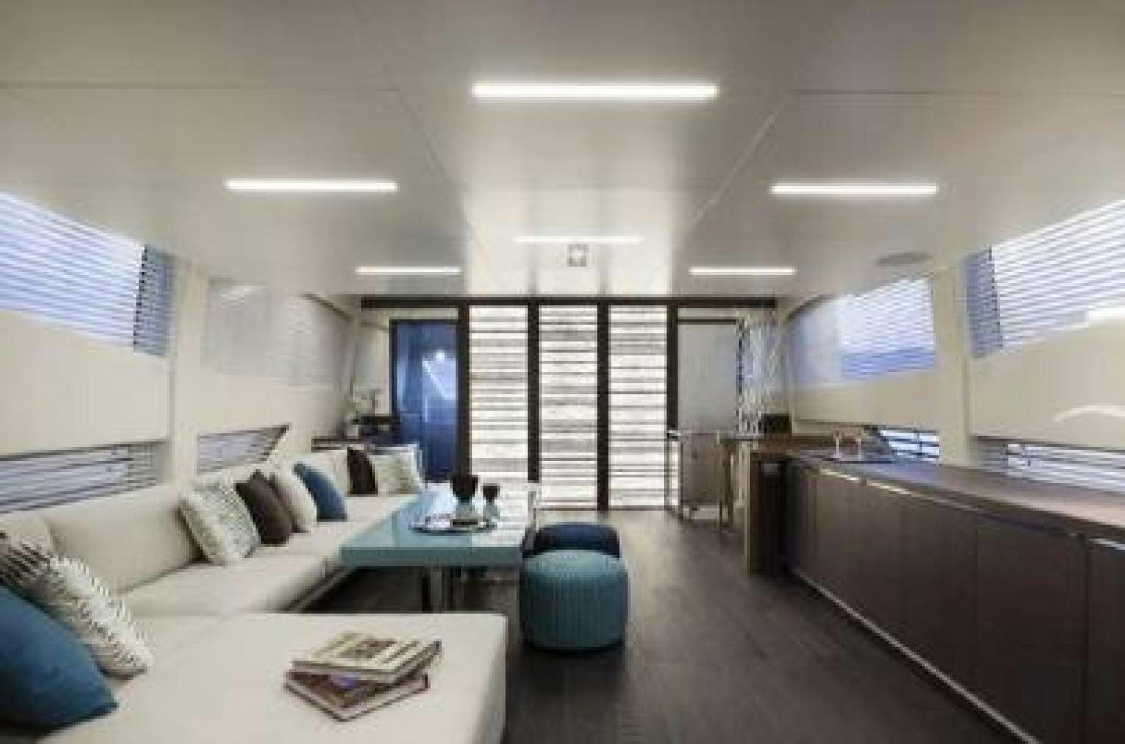 a living room with a couch and a table aboard No Name Yacht for Sale
