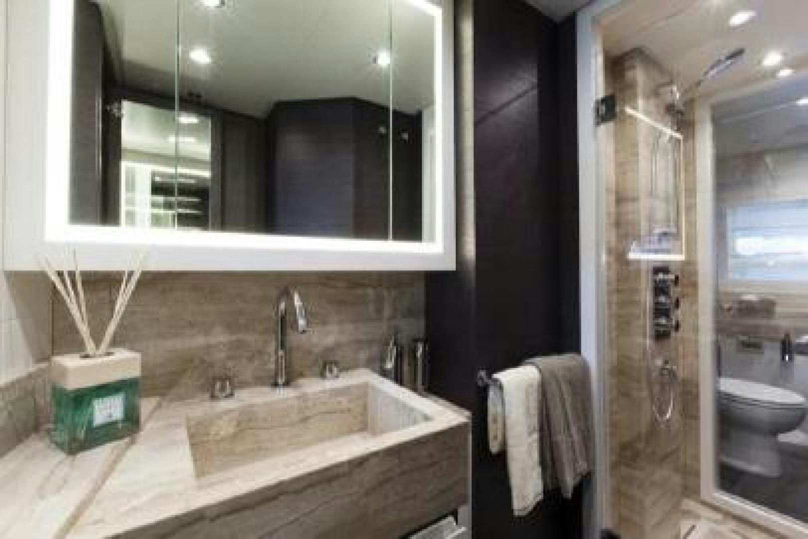 a bathroom with a sink and a mirror aboard No Name Yacht for Sale