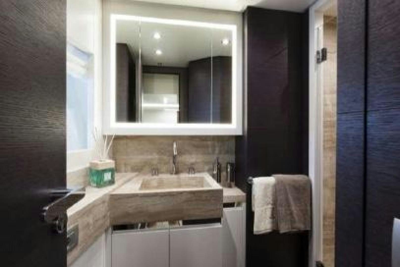 a bathroom with a sink and a mirror aboard No Name Yacht for Sale