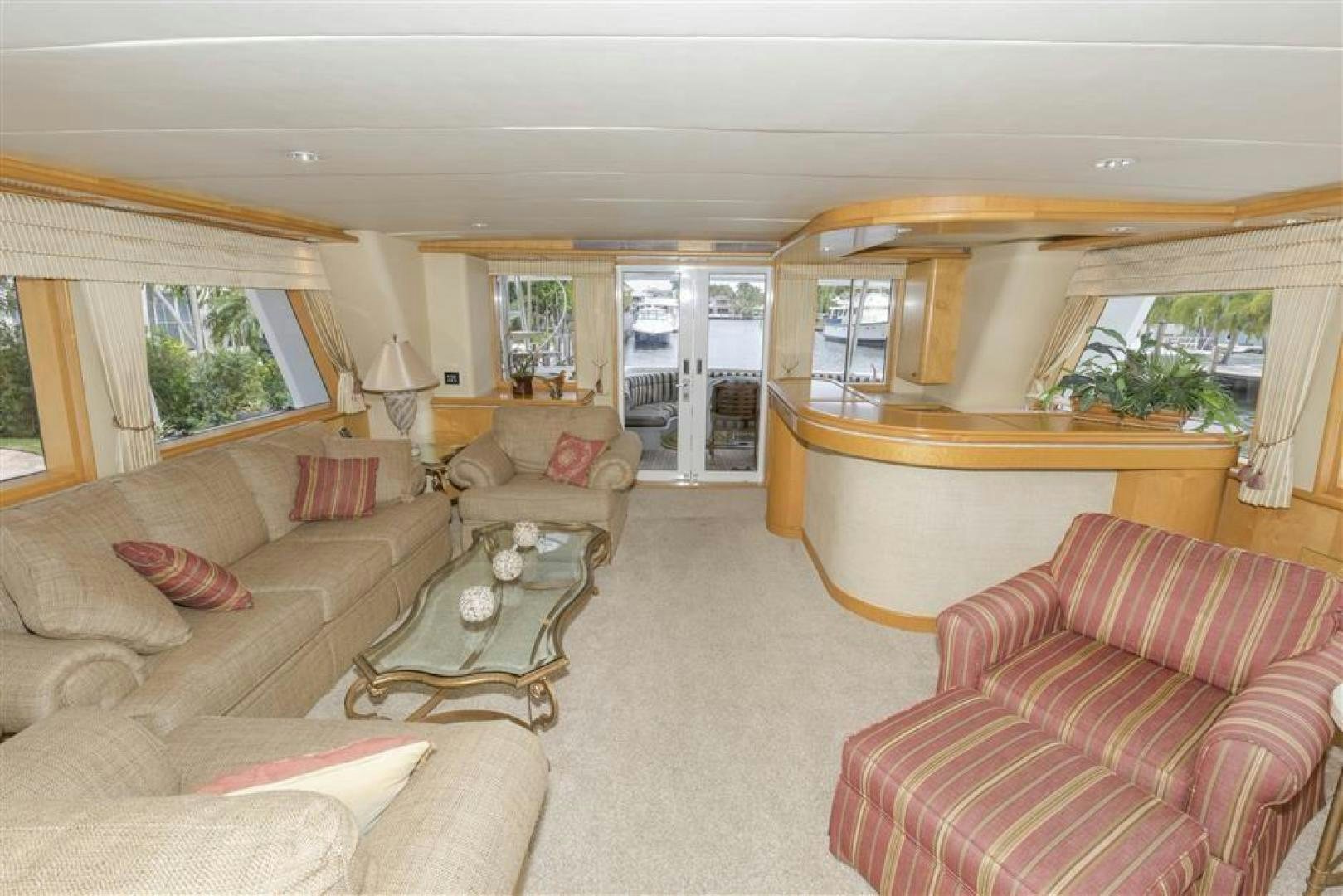 a living room with a couch and a table aboard DETERMINATION Yacht for Sale