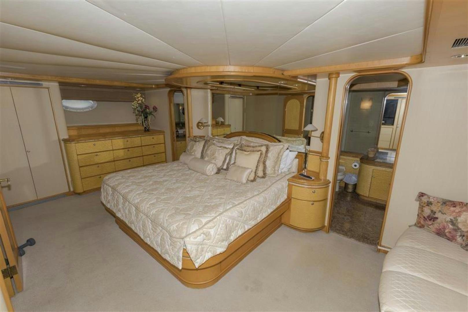 a bedroom with a large bed aboard DETERMINATION Yacht for Sale