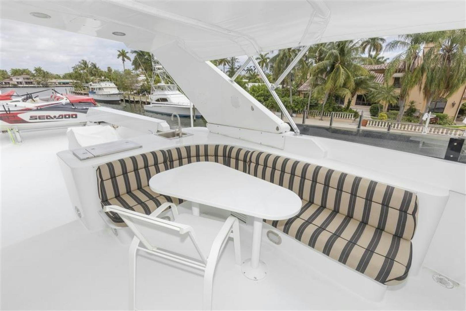 a table and chairs on a balcony aboard DETERMINATION Yacht for Sale