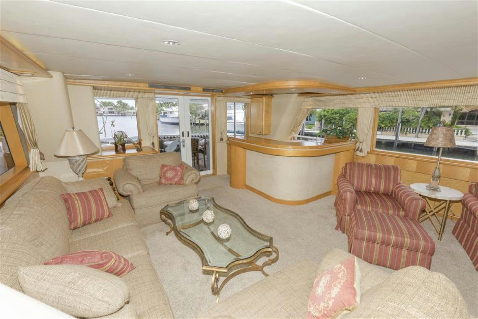 a living room with a large window aboard DETERMINATION Yacht for Sale