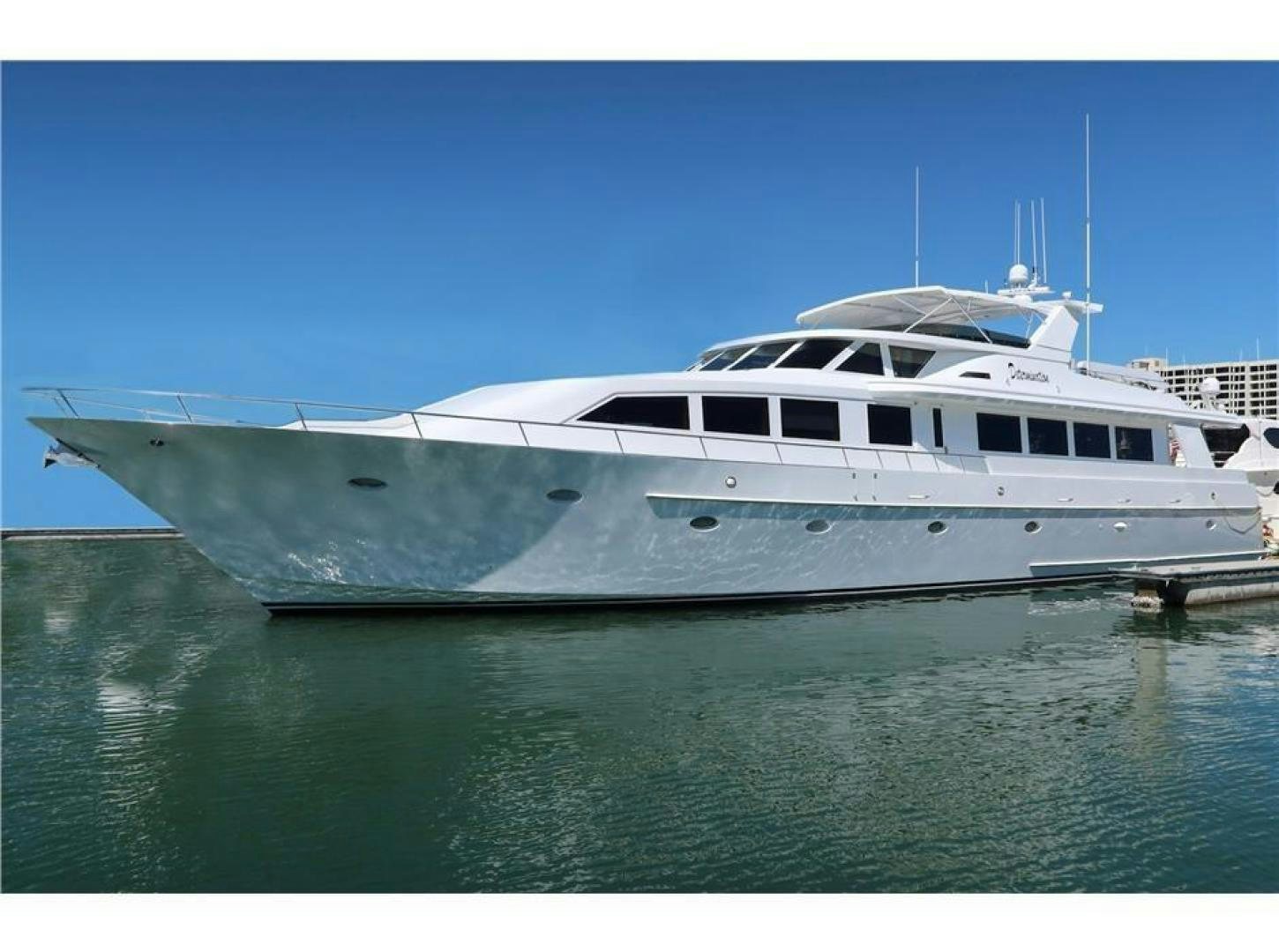 a large white yacht aboard DETERMINATION Yacht for Sale