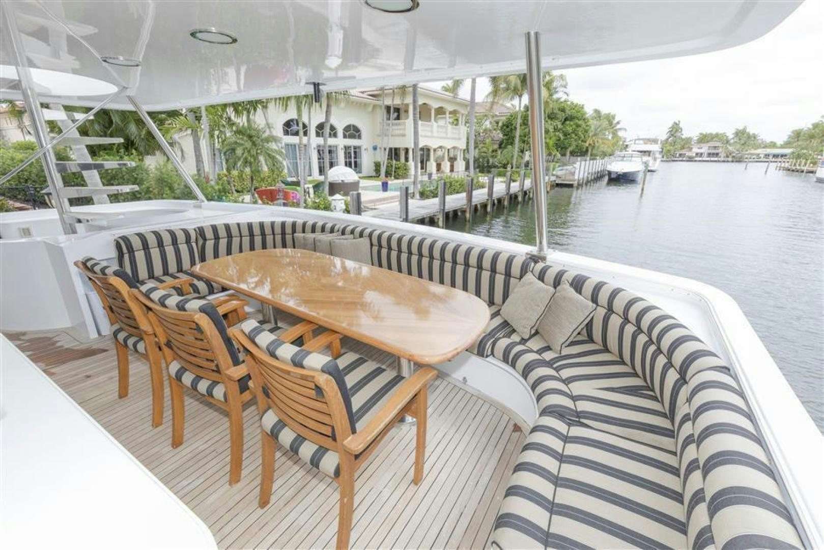 a table and chairs on a deck aboard DETERMINATION Yacht for Sale