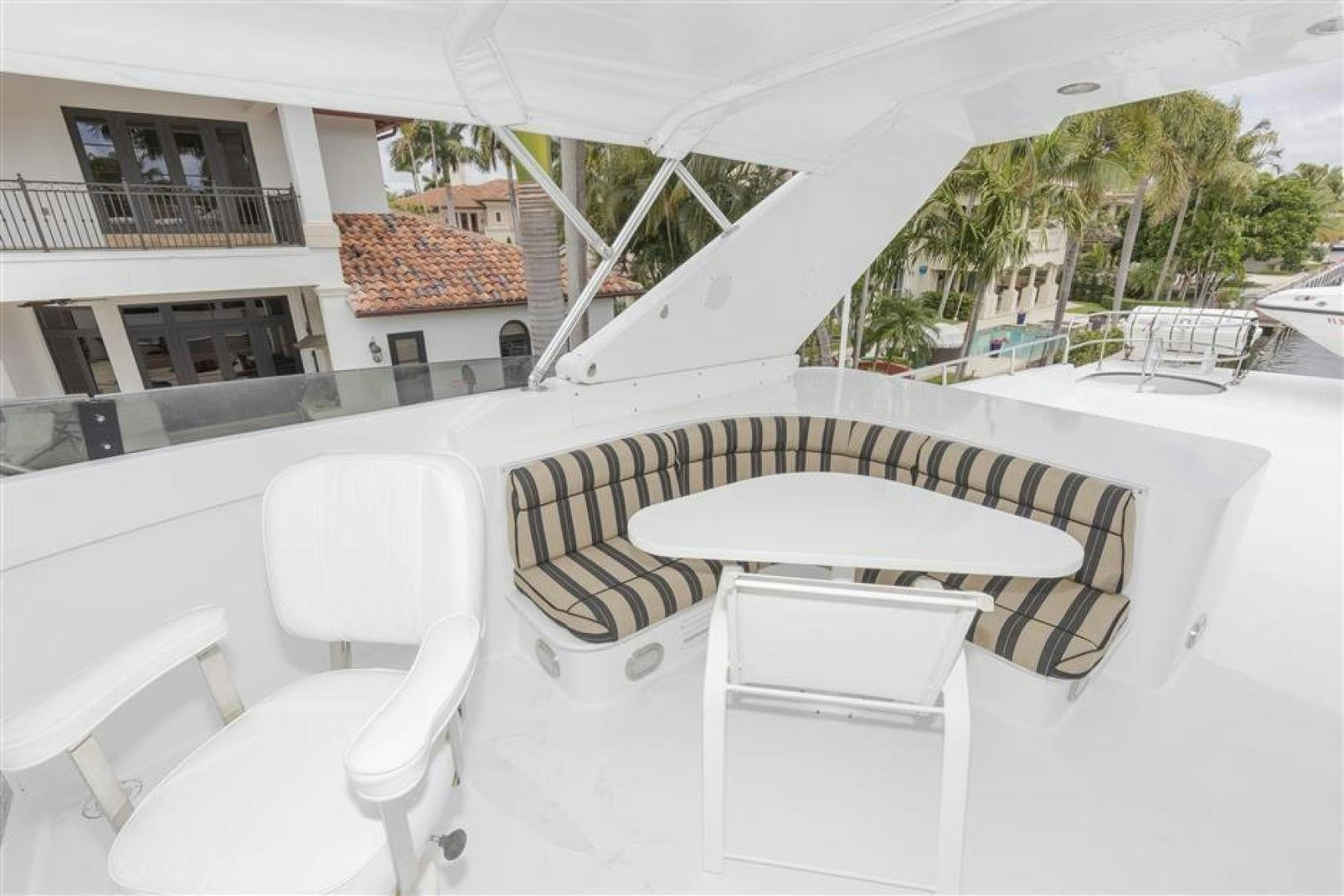 a table and chairs outside of a house aboard DETERMINATION Yacht for Sale