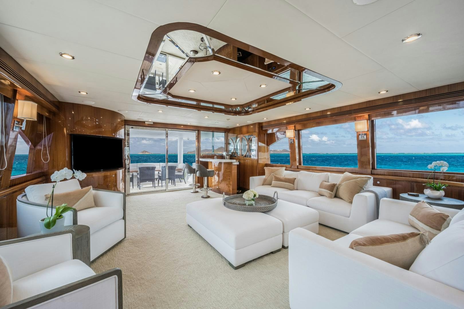a living room with a large ceiling aboard LIMITLESS Yacht for Sale