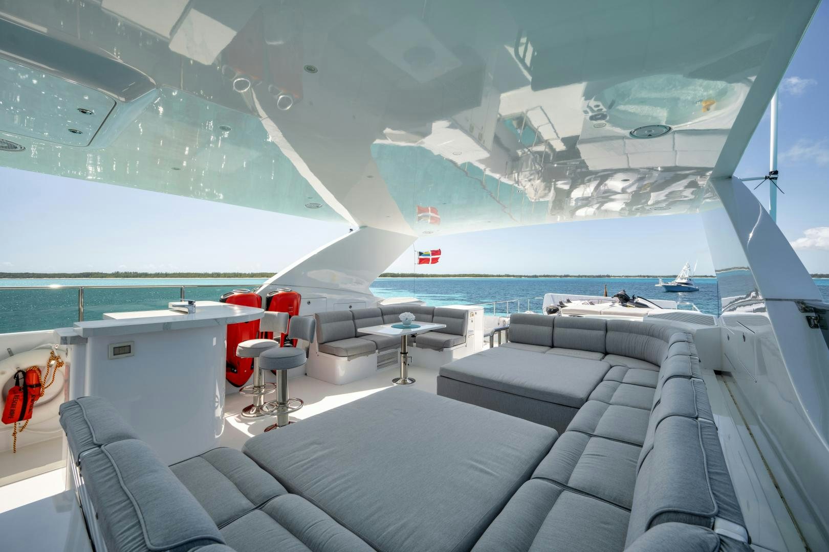 inside of a building with a large window and a view of the ocean aboard LIMITLESS Yacht for Sale