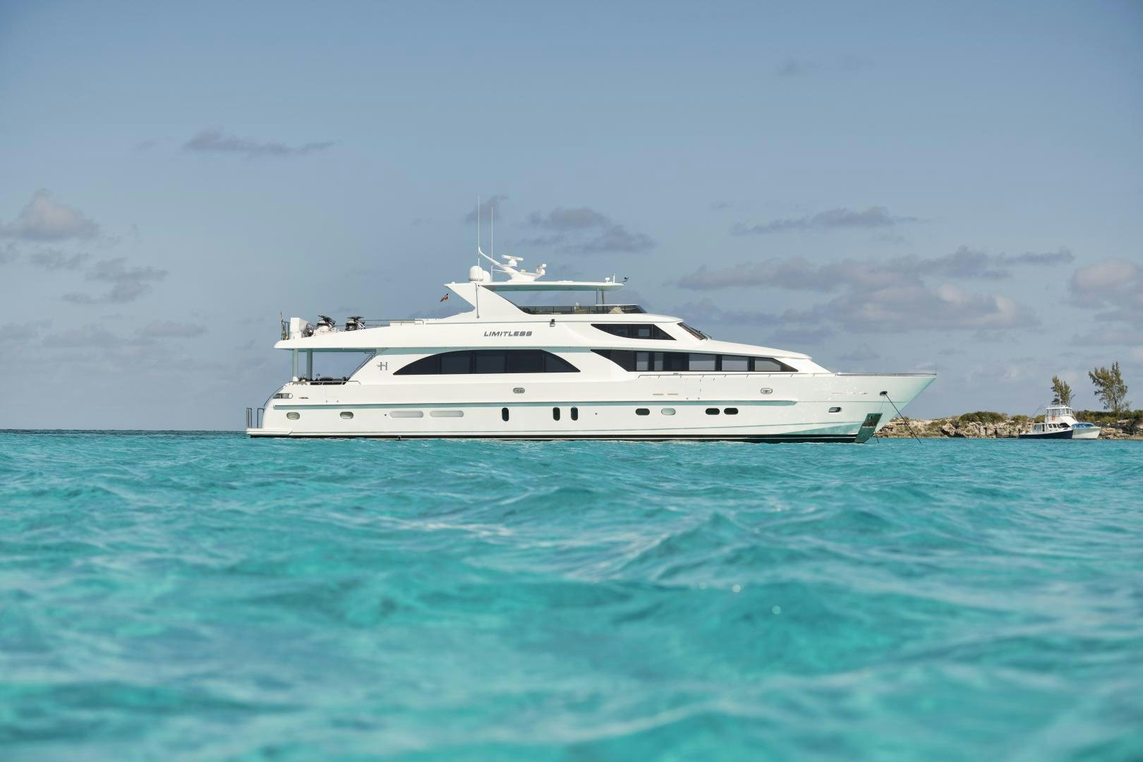 a white yacht in the water aboard LIMITLESS Yacht for Sale
