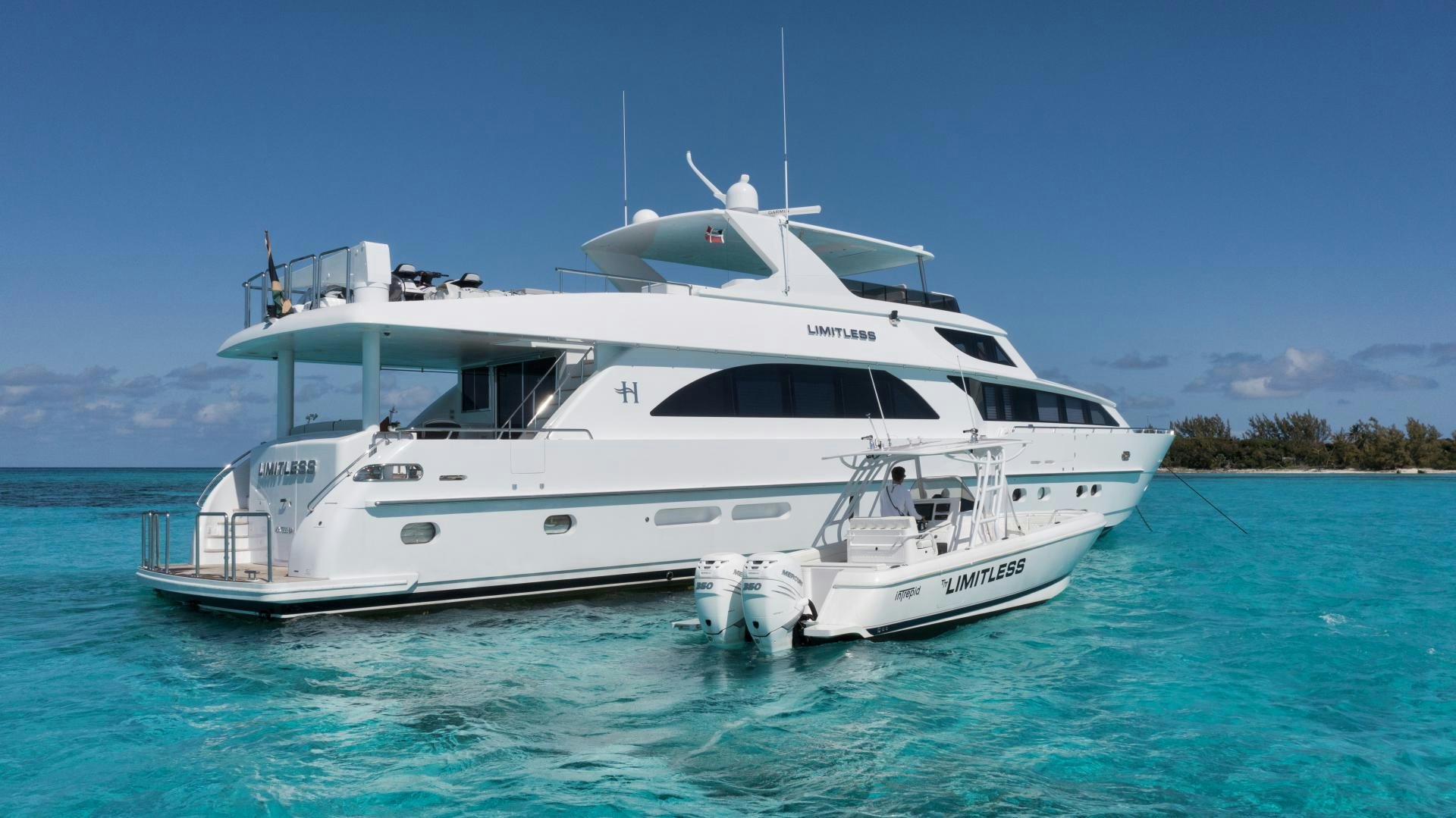 a white yacht in the water aboard LIMITLESS Yacht for Sale